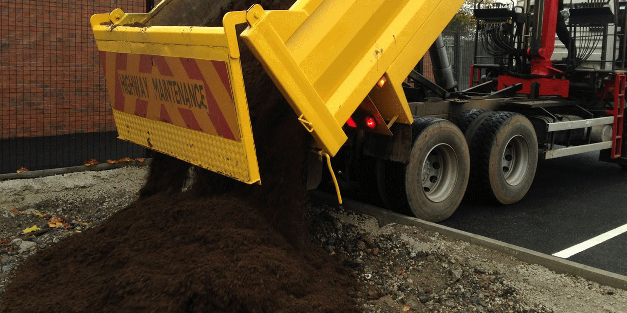 a grab lorry clearing waste